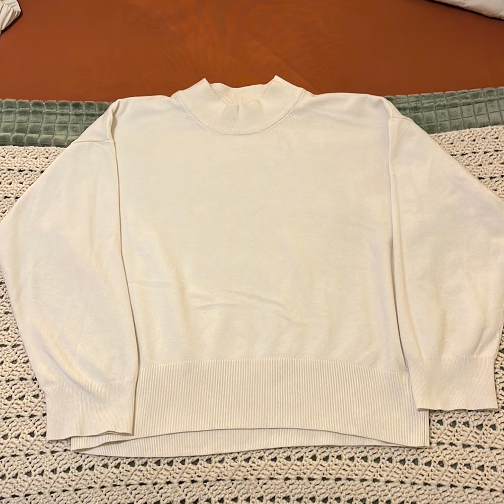 White mock-neck sweater